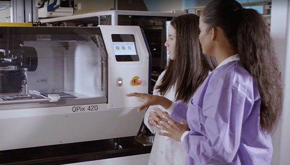 Scientist working on QPix 400 System