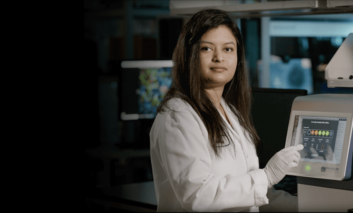 Scientist working on Multi-mode Microplate Readers